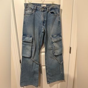 Low waisted Zara denim cargo pants. I’m 5’6 and it’s a bit long on me.